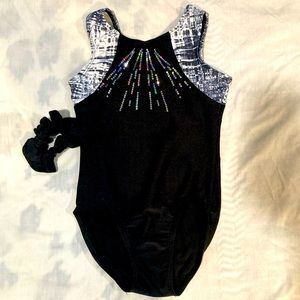 Black and white sequence very shiny gymnastics leotard. Brand new never used. CM